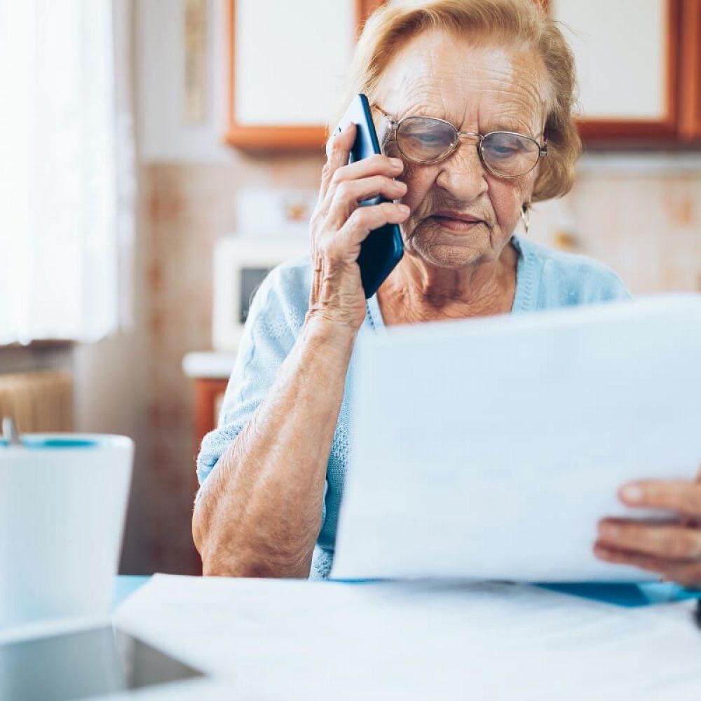 elderly-woman-contacting-custumer-services-after-recieving-a-bill-1